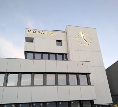 Final installation phase of a facade clock located in Dübendorf